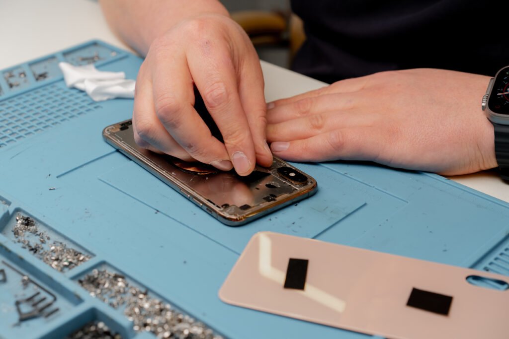 Macro shot - phone being repaired by an engineer
